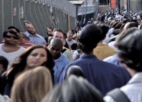 Commuters make their way to work through morning traffic